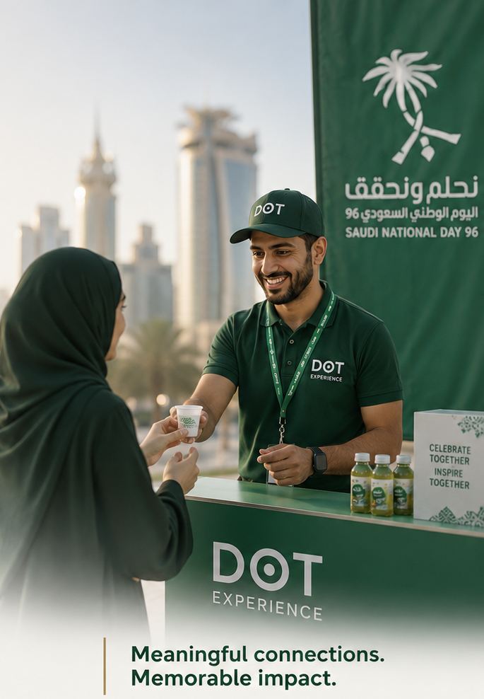 A DOT Experience promoter handing a product sample to a visitor during a National Day activation